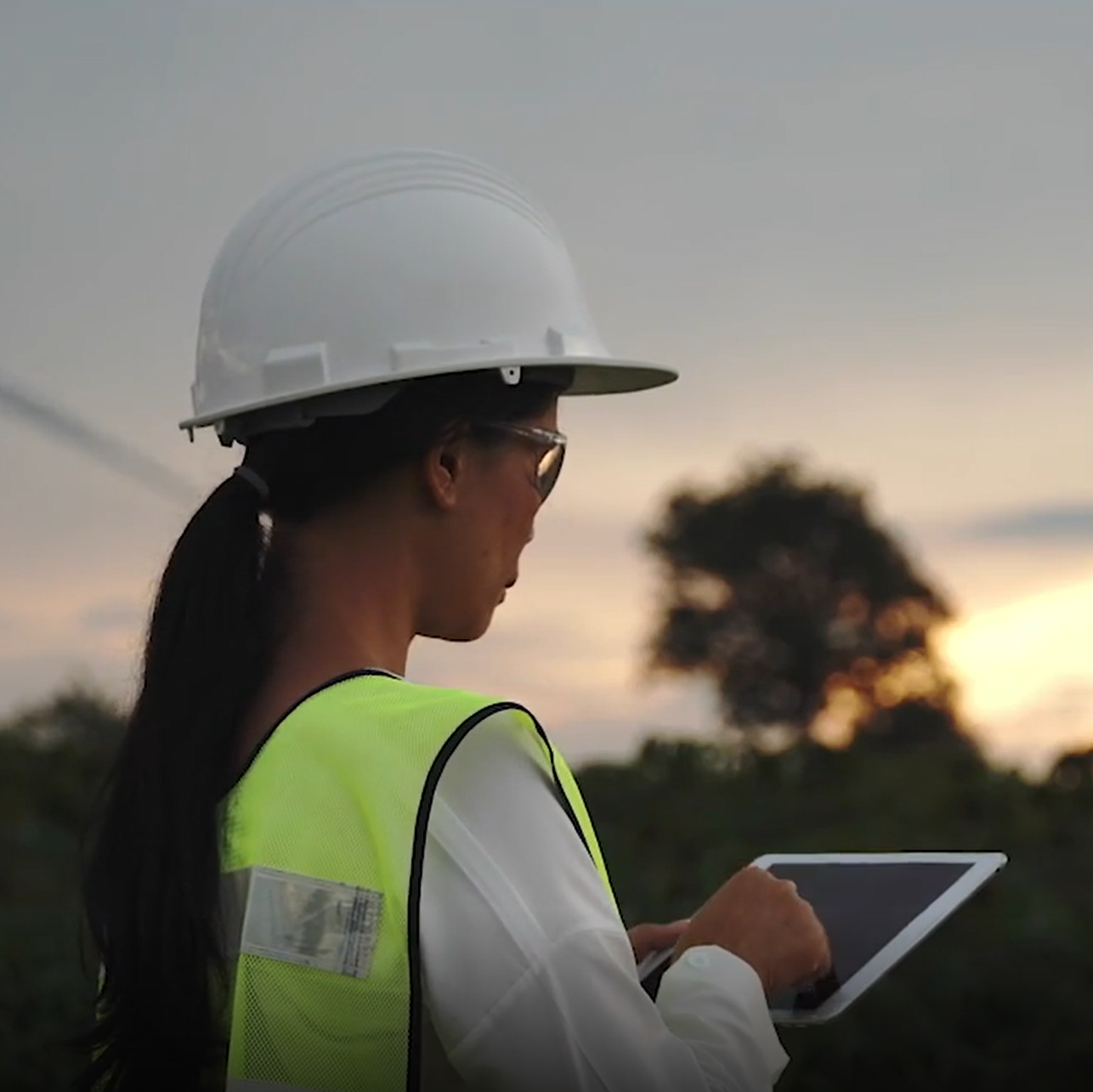 Land surveyor working outside.