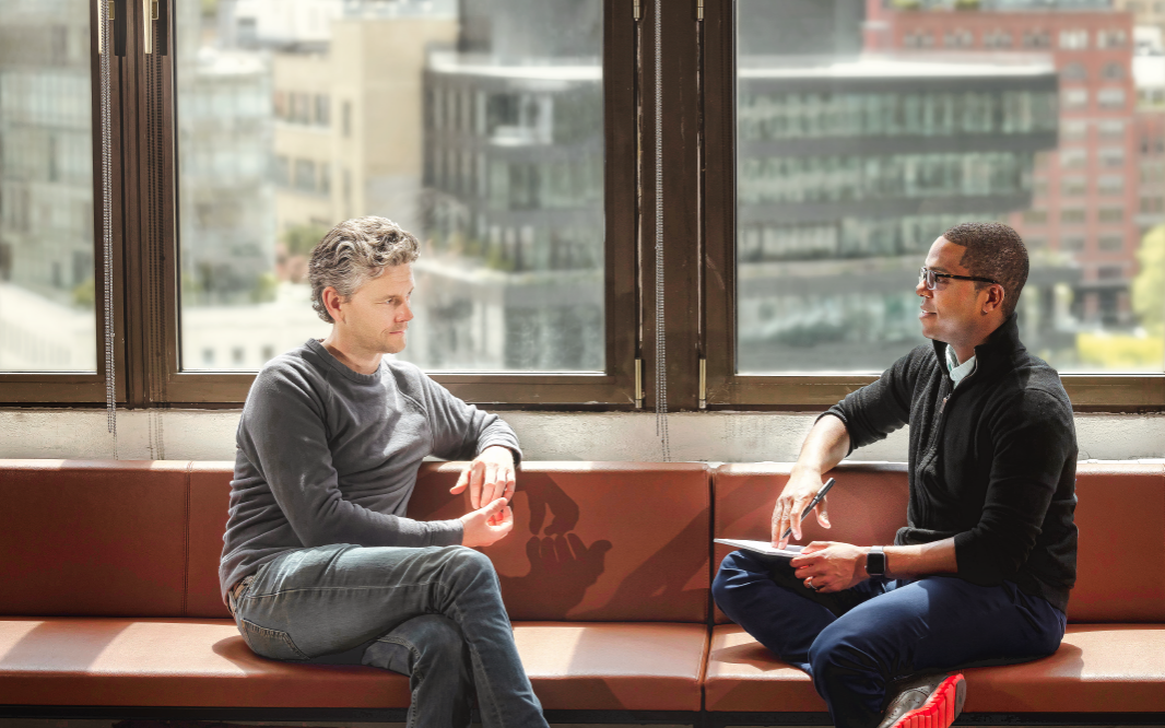 Professor chatting with a Two Sigma employee.