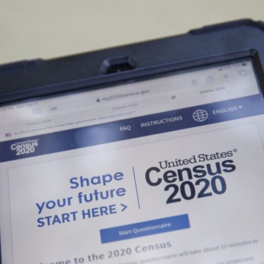 Phone displays the U.S. Census 2020 website, encouraging people to ‘shape your future’ by answering the questionnaire.