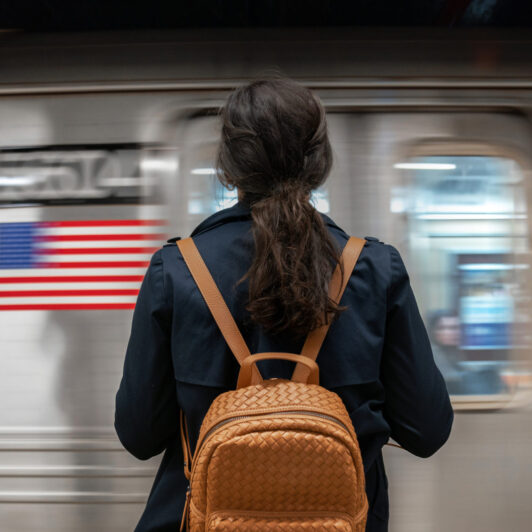 Woman waits on a New York City subway platform.