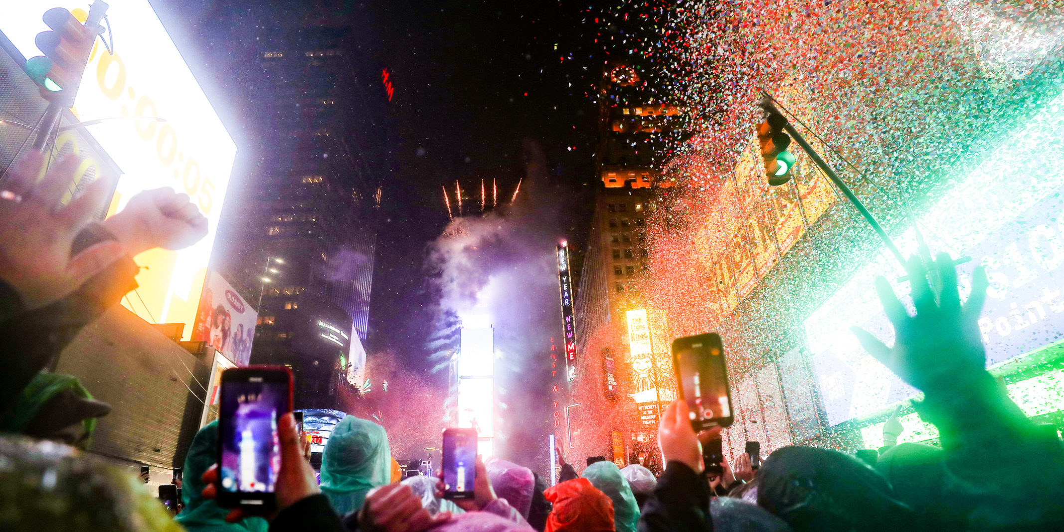 Crowd celebrating New Years Eve outside in Times Square, New York City.