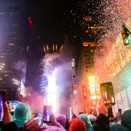 Crowd celebrating New Years Eve outside in Times Square, New York City.