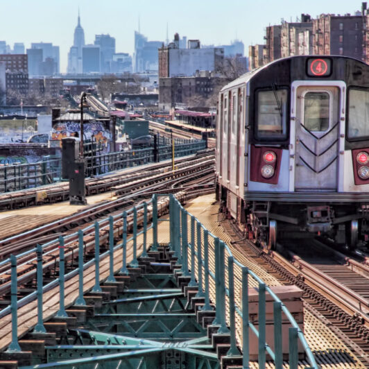 Above-ground subway track in a New York City borough.