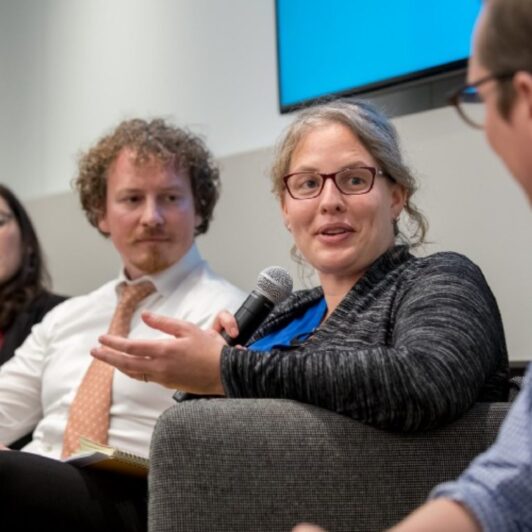 Panelists chat amongst each other at the Data for Good conference.