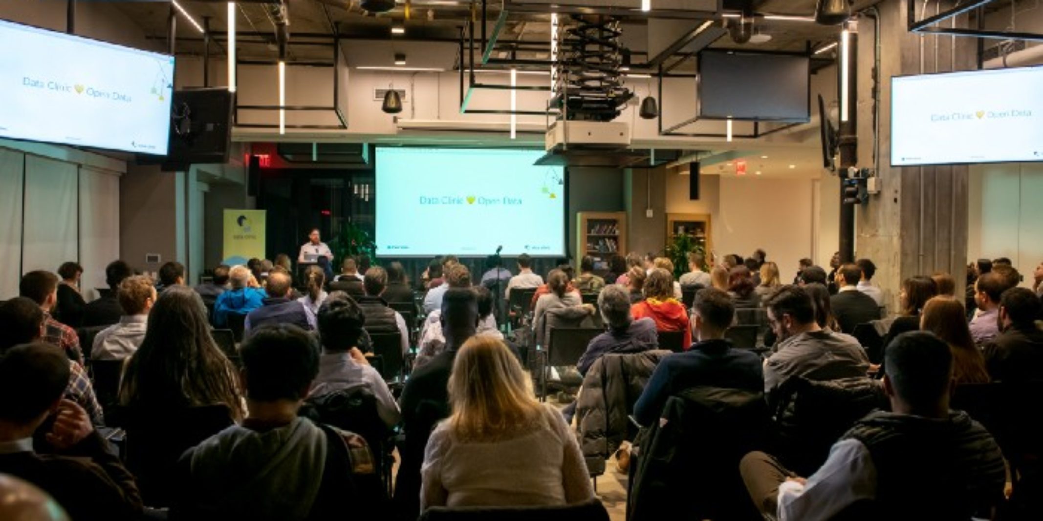 A member of Data Clinic presents to an audience of people at NYC Open Data Week.