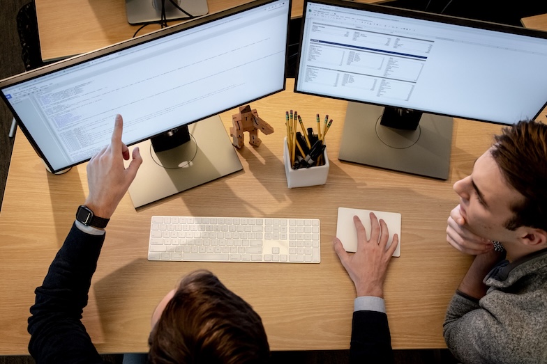 Person working on 2 screens
