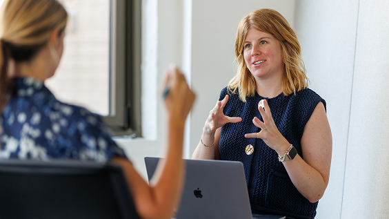Early career employees talking