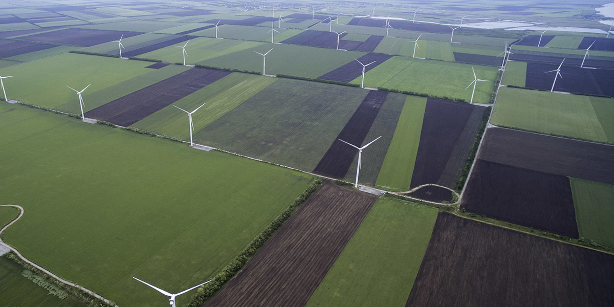 A sky view of a windmill farm