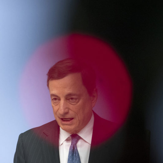 Picture of Mario Draghi giving a speech with a red circle over his him