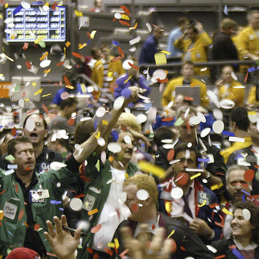 Stock brokers celebrating with confetti